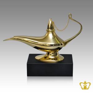 Masterpiece-Metal-Genie-Lamp-with-Intricate-Detailing-stands-on-Wooden-Base