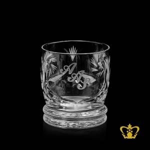 Handcrafted-elegant-crystal-whisky-glass-with-unique-cut-twirling-star-deep-leaf-design-text-engraved-around-the-glass