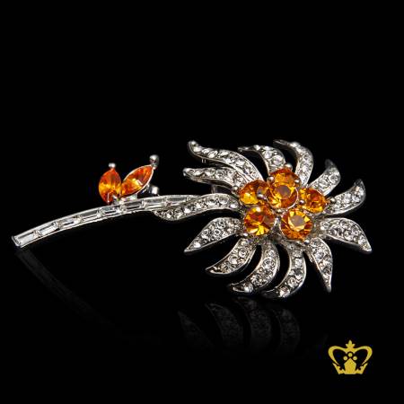 Crystal-brooch-flower-shape-embellished-with-sparkling-yellow-and-clear-crystal-diamond