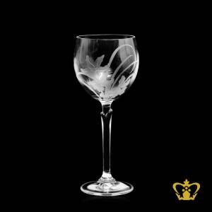 Crystal-wine-glass-with-long-stem-and-flower-design-on-goblet