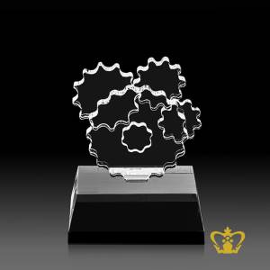 Manufactured-Crystal-Replica-of-a-Cogwheel-Trophy-with-Intricate-Detailing-stands-on-Black-Crystal-Base