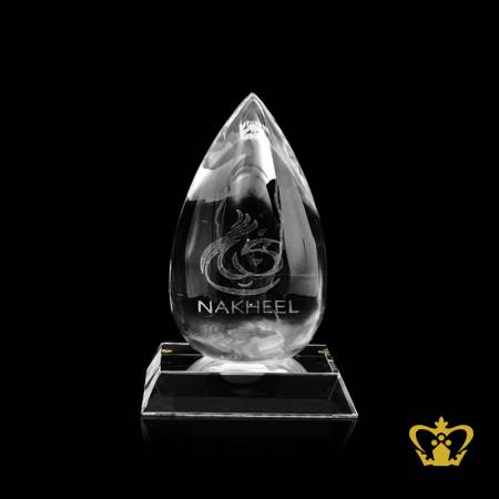 Personalized-crystal-drop-trophy-laser-engraved-logo-and-text-NAKHEEL-with-clear-base