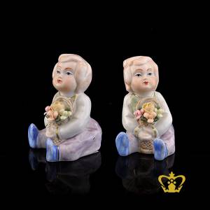 A-Masterpiece-Ceramic-Figurine-of-a-Baby-Doll-holding-a-Basket-with-Bouquet-of-Flowers