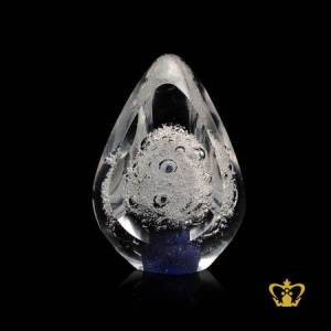 Artistic-mesmerizing-crystal-paper-weight-in-blue-tone-with-intricate-bubbles-inside-for-desktop