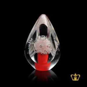 Artistic-mesmerizing-crystal-paper-weight-in-red-tone-with-intricate-bubbles-inside-for-desktop